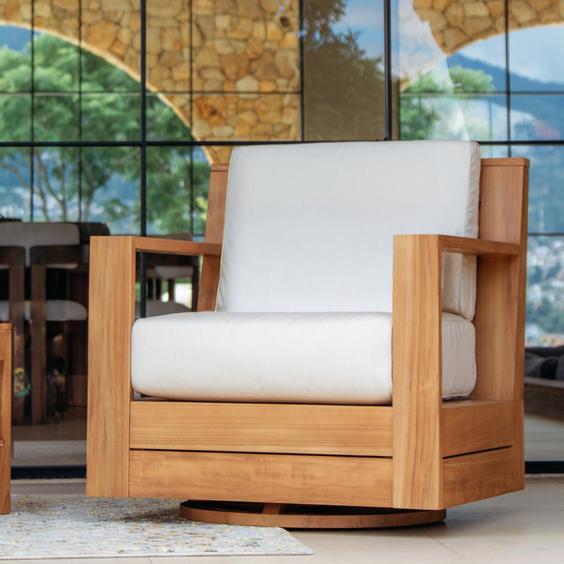 Wooden armchair with white cushion in an outdoor setting